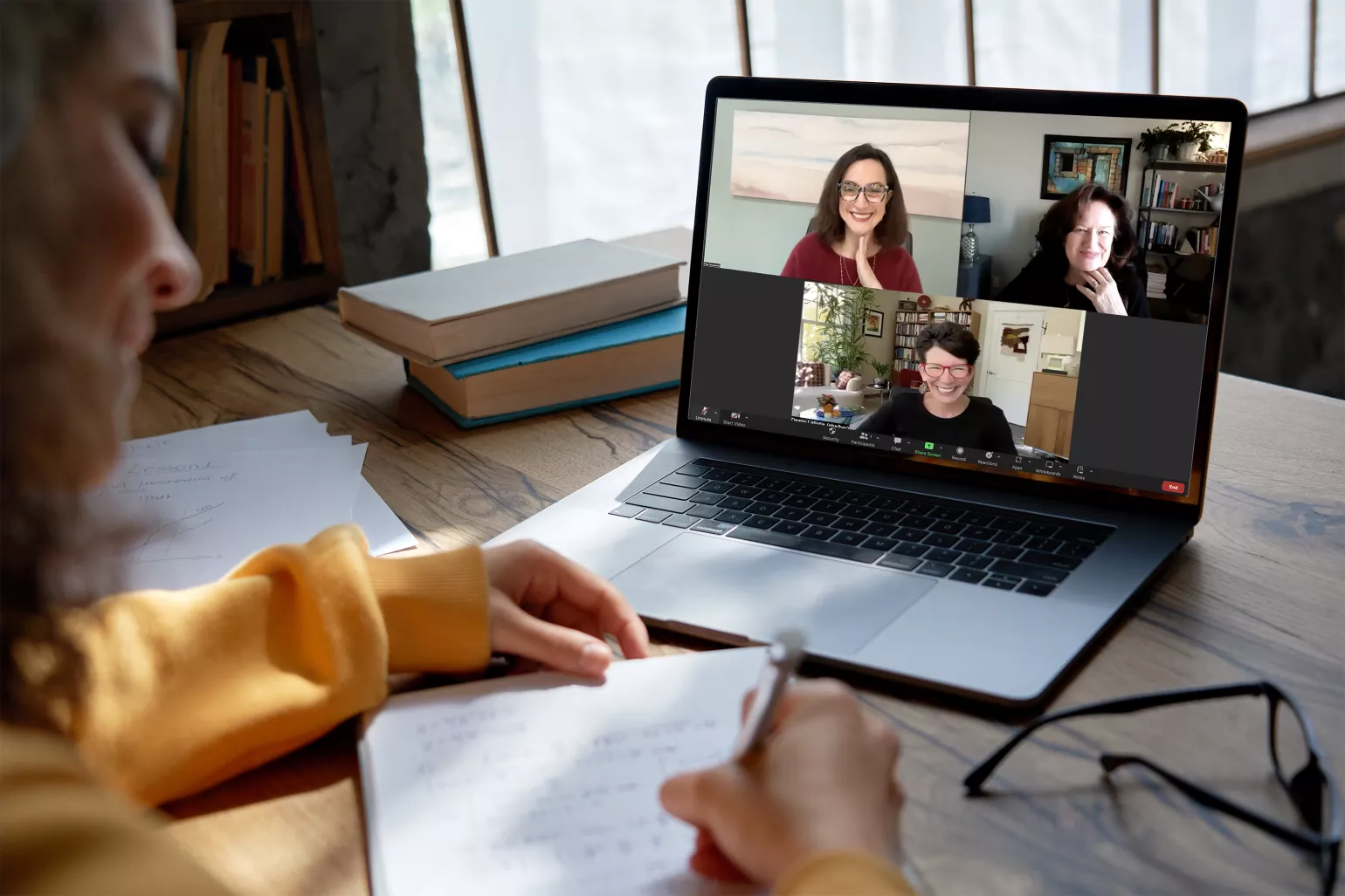 Woman on a Zoom call with Deany Laliotis, Mary French and Erika Tsoukanelis