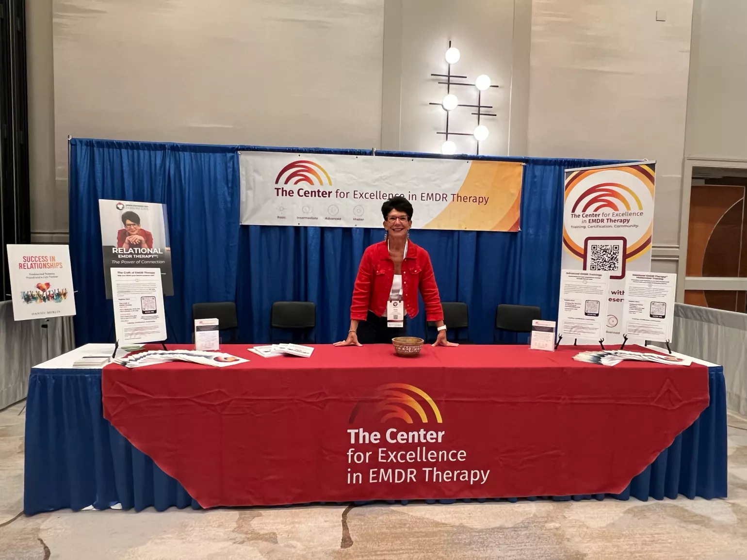 Deany at The Center's booth at the EMDRIA Conference