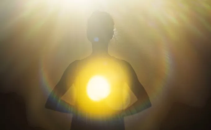 Woman radiating light from within