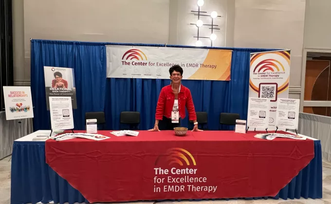 Deany at The Center's booth at the EMDRIA Conference